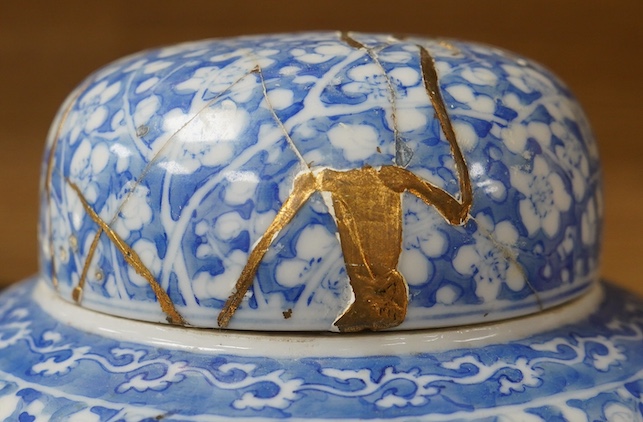 A Japanese Seto blue and white lidded ginger jar, 24cm high. Condition - lid poor (repaired in Kitsugi fashion with staples and filler visible to interior) body fair with one visible star crack.